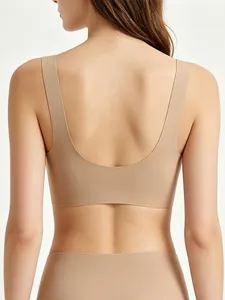 Deep U-shape back view of a seamless nude bra showing smooth fit and wide straps
