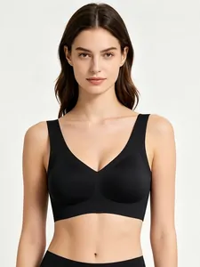 Close-up of black seamless V-neck sports bra with wide straps and smooth fabric texture