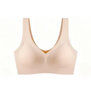 Detail of seamless V-neck sports bra in beige with wide straps and smooth fabric