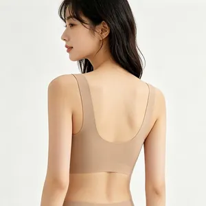 Seamless V-neck beige bra featuring wide straps and a deep U-shaped open back design