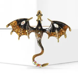 Detailed close-up of a dragon brooch with colorful rhinestones and enamel on a white stand