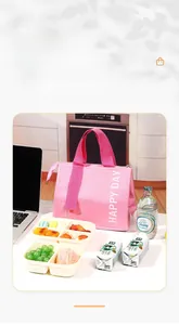 Detailed view of pink insulated lunch bag with Happy Day text and spacious storage