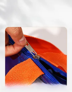 Close-up of insulated lunch bag featuring blue zipper and durable metal pull tab
