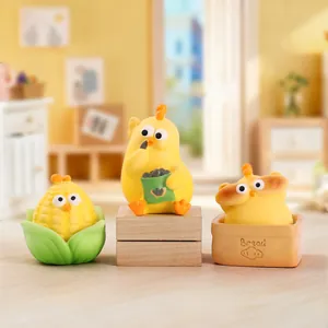 Three cute yellow chick resin figurines in mini corn, snack bag, and bread box displays