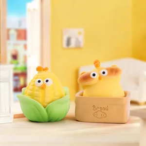 Close-up of creative corn and bread themed cartoon chick figurines as desk decor