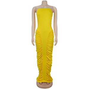 Detail of ruched sides on a bright yellow strapless bodycon maxi dress for women