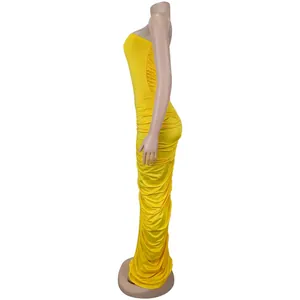 Detail of side ruching on a bright yellow strapless bodycon floor-length dress