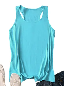 Flat lay of a light blue summer tank top paired with denim shorts and pearl sandals