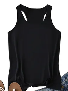 Flat lay of a black racerback tank top with denim shorts for a casual summer outfit