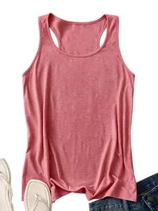 Flat lay of a dusty rose ribbed tank top with white sandals and denim jeans