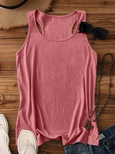Flat lay of a summer ribbed tank top in mauve color with vacation style accessories