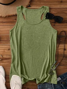 Flat lay of a grass green sleeveless tank top with natural linen texture on a wood surface