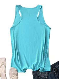 Detailed flat lay of bright blue racerback tank top with summer sandals and denim wear