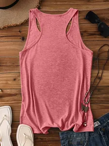 Flat lay of pink racerback tank top with straw hat and sunglasses for summer vacation