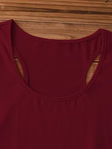 Detailed macro view of burgundy racerback tank top neckline on wooden background