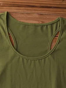 Detail view of military green knitted tank top showing ribbed texture and stitching