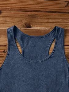 Detail of navy blue heathered ribbed tank top with U-neck on dark wood background