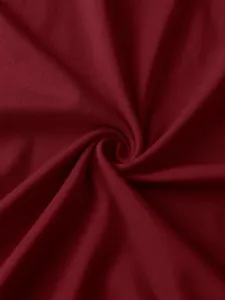 Detail of soft burgundy ribbed knit fabric with smooth texture and elegant drape