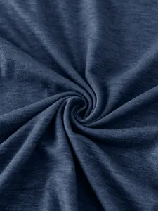 Detailed macro view of dark blue jersey fabric showing soft texture and knit pattern