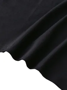 Detail of black knitted tank top showing fine fabric texture and double-needle hem stitching