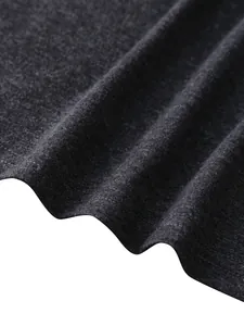 Close-up of charcoal heather knit fabric with double-needle stitching on the hem