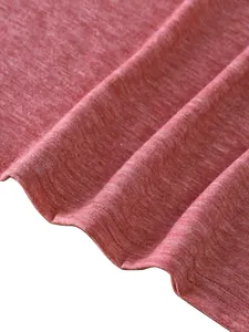 Macro shot of double-needle stitching on heathered red knit fabric hem for casual tank tops