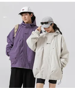 Detail view of purple and beige hooded windbreakers with drawstring and urban utility style