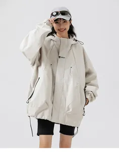 Detail of loose-fit hooded outdoor jacket in off-white featuring adjustable drawstring hem