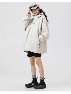 Detail of loose-fit hooded jacket with dropped shoulders and adjustable drawstring hem