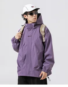 Close-up of deep purple outdoor jacket featuring velcro cuffs and spacious cargo pockets