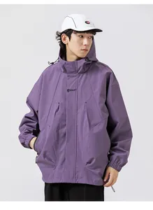 Detail view of purple hooded outdoor jacket with logo print and windproof material