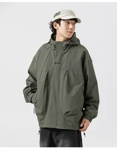 Detail of army green outdoor jacket featuring large cargo pockets and windproof hood