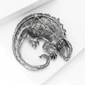Detailed back view of vintage silver lizard brooch showing the secure safety pin fastener