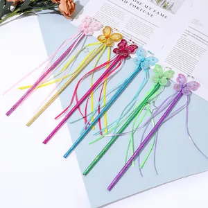 Close-up of 6-piece colorful mesh butterfly fairy wands with sequins and hanging ribbons