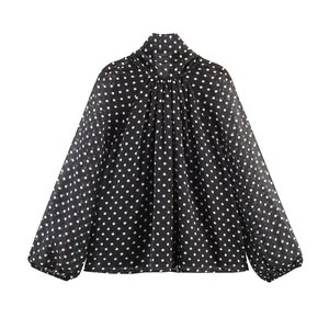 Classic black long-sleeve blouse with white polka dot pattern and scarf collar detail