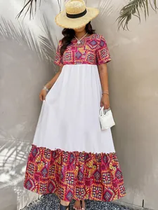 Detail of bohemian maxi dress showing ethnic geometric prints and white panel patchwork