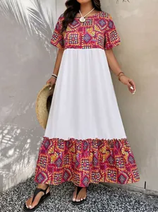 Detail of bohemian tiered maxi dress featuring ethnic geometric patterns and ruffles