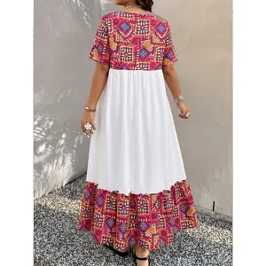 Bohemian maxi dress with colorful ethnic patterns and short sleeves in white A-line style