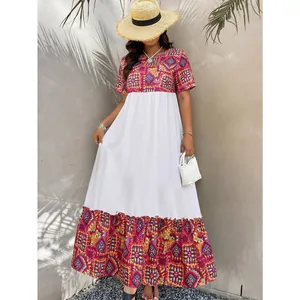 Bohemian patchwork maxi dress with geometric patterns and short sleeves for summer vacation