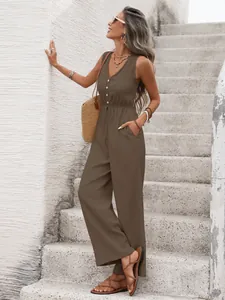 Detail of coffee sleeveless jumpsuit with deep V-neckline and drawstring waist texture