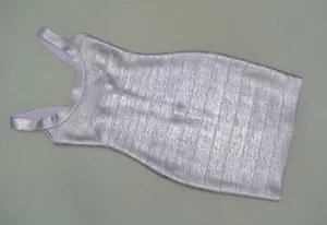 Detailed close-up of metallic pink purple bodycon dress with sparkling fabric texture