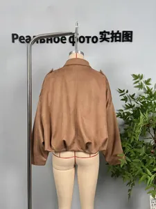 Rear view of brown faux suede bomber jacket with elastic hem and drop shoulder design