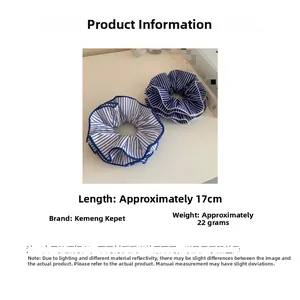 Detail showing blue and white striped fabric scrunchie measuring 17cm in length