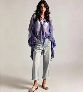 Close-up of sheer purple lace cardigan with tiered ruffles and flared sleeves details