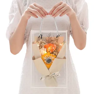 Soap rose and sunflower bouquet in transparent PVC bag with LED lights and white bow