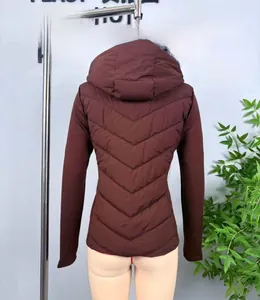 Detail of burgundy hooded puffer jacket with diamond quilting and windproof fabric