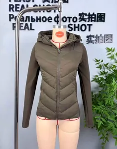 Detail of hooded quilted jacket with V-shaped stitching and olive green fabric texture