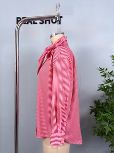 Detailed side view of pink and white striped shirt with pussy-bow tie neckline