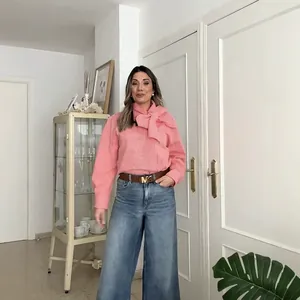 Elegant pink pleated long sleeve shirt with large pussy-bow neck and striped texture