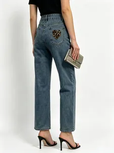 Women's wide leg jeans with heart leopard print back pocket in mid blue wash